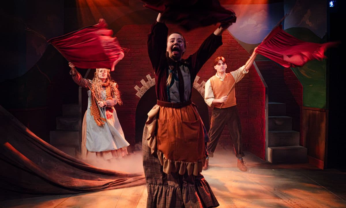 The Railway Children waving red flags to stop the train